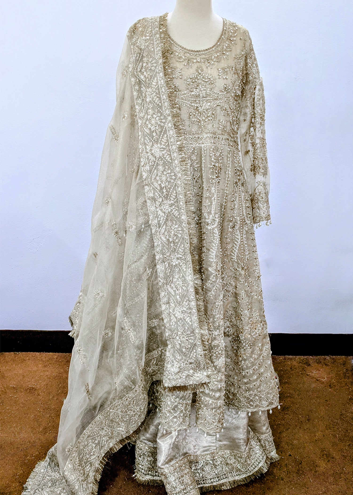 khaddi net Lehenga in Champagne