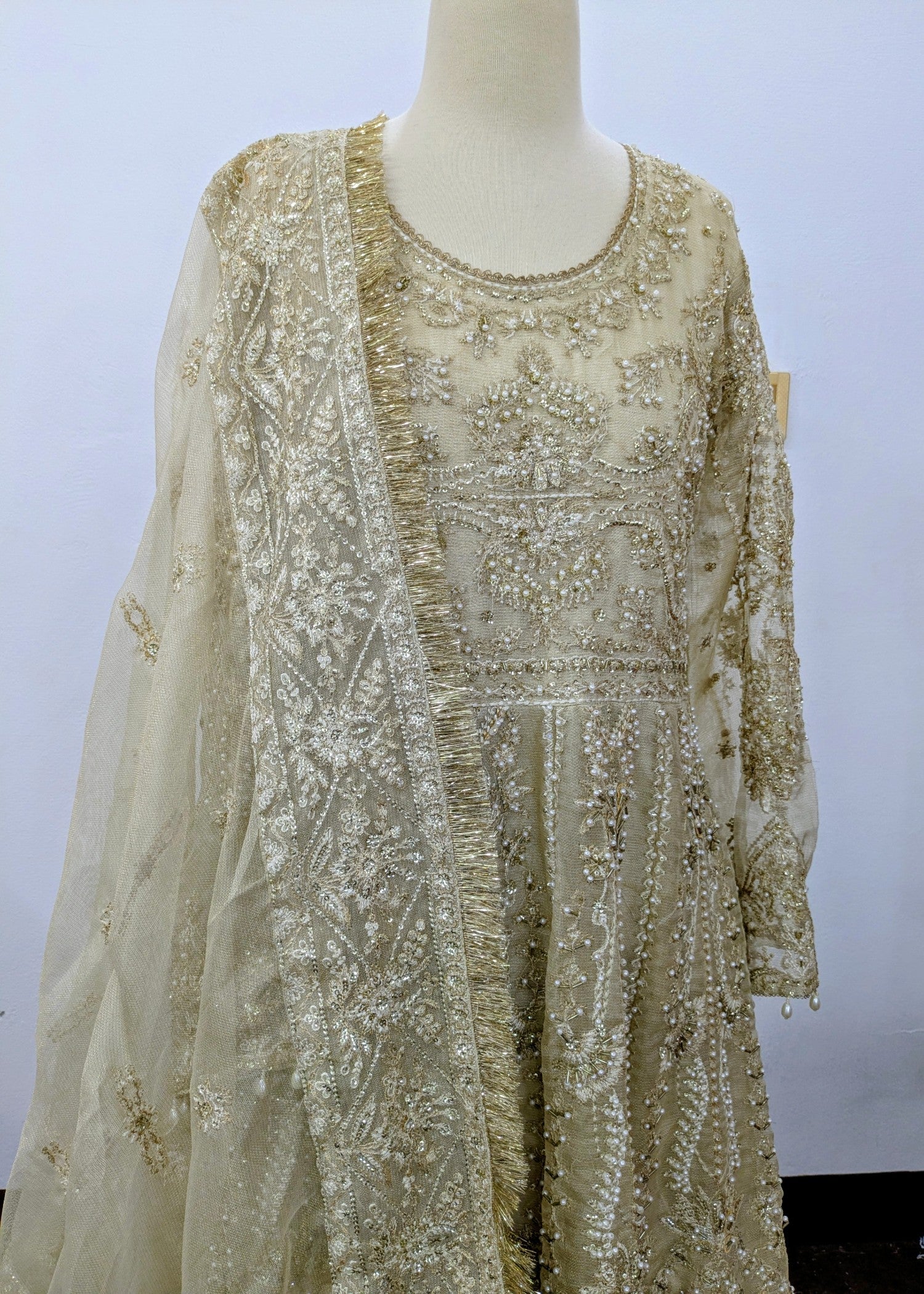 khaddi net Lehenga in Champagne